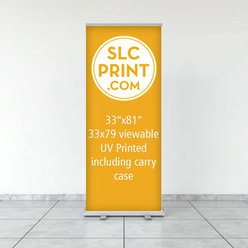 Picture of a retractable banner that is on a tile floor. It is advertising a 33x81 uv printing display