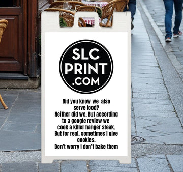 A picture of a custom sign attached to a signacade deluxe on he corner outside of a cafe