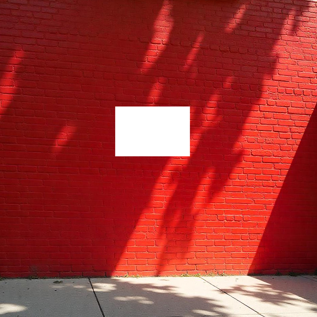 a horizontal sign in front of a red wall